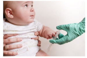 Baby being immunised