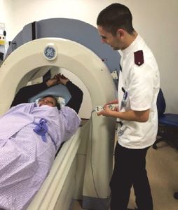 A patient coming out of the scanning machine. 